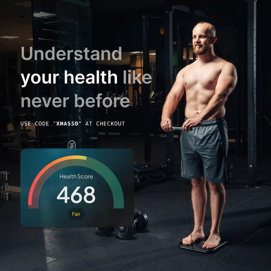 Man weighing himself on a Hume Body Pod with a holiday 50% promotion